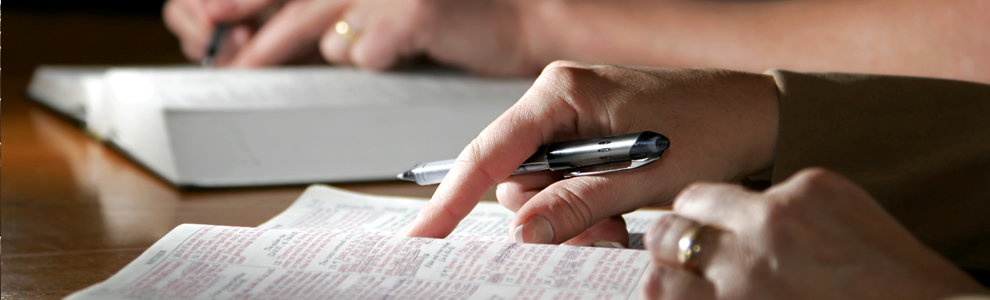 man writing on a piece of paper